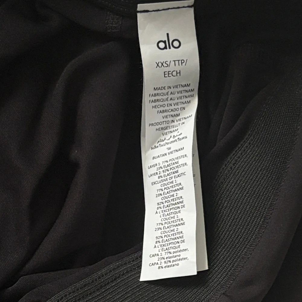ALO Yoga Airlight Down The Line Black Mini Tennis Skirt with shorts underneath